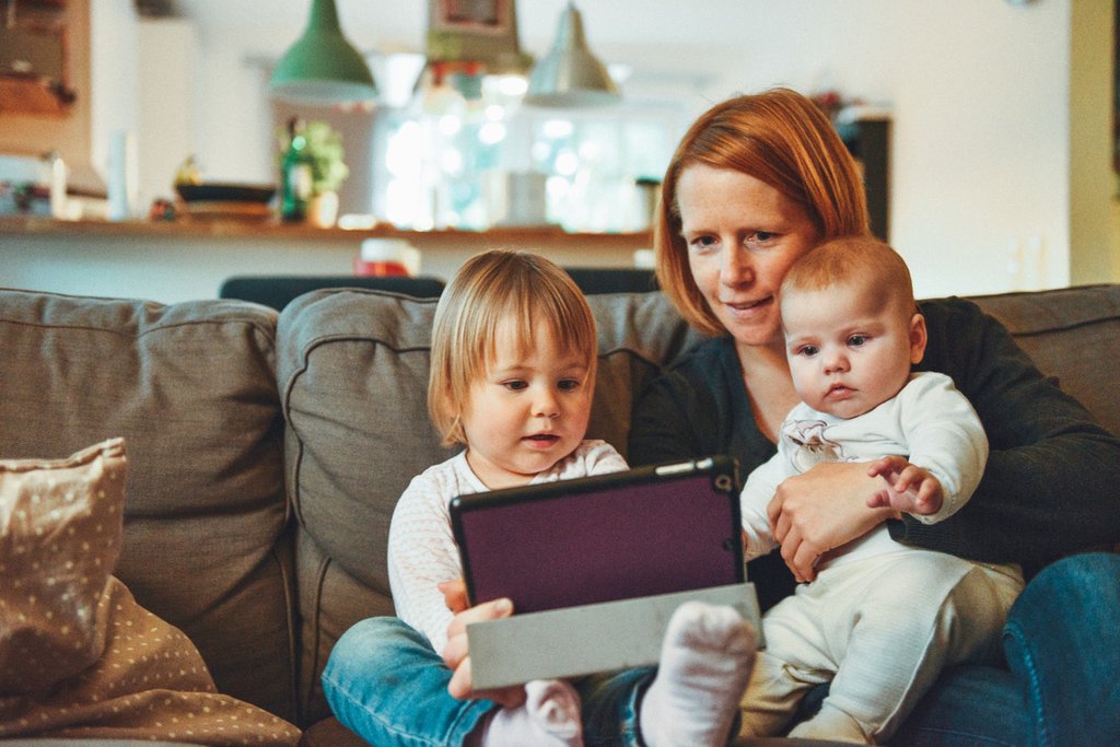 Mother reading to daughter 